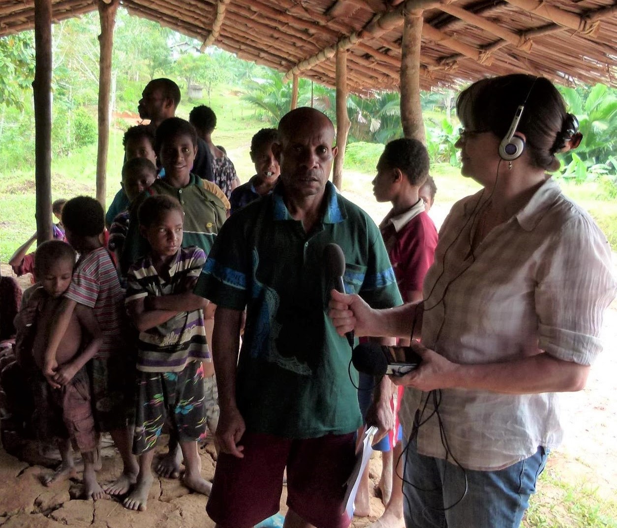 Jemima Garrett on assignment for Radio Australia in Drimgas village, Western Province, Papua New Guinea
