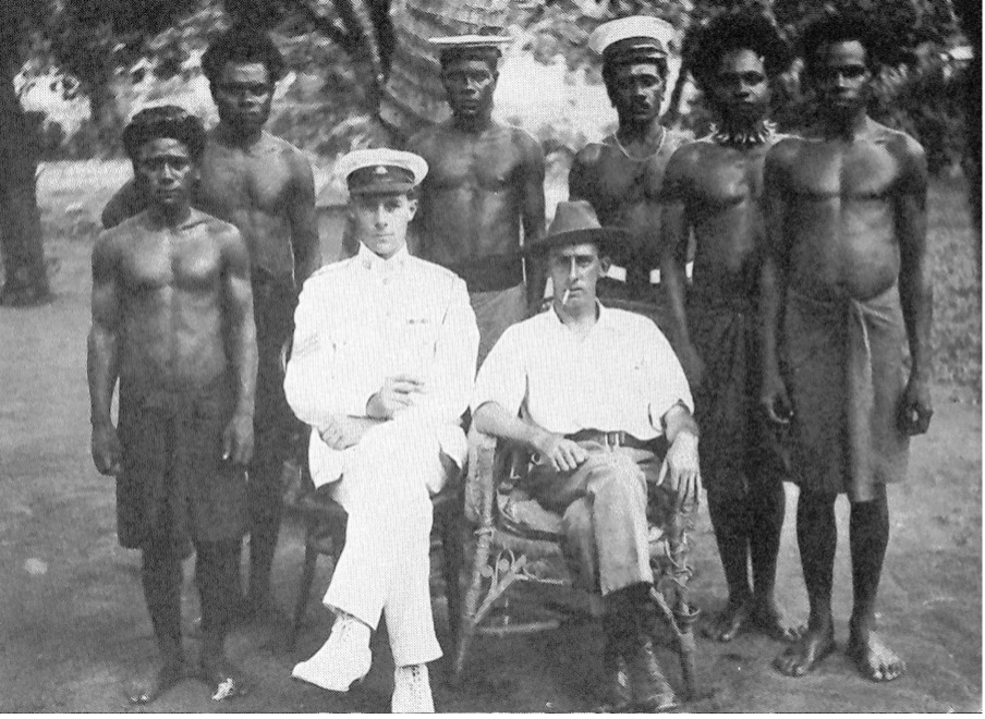 Police masters Sergeant Gouday and Private Pilkington with a group of Papuan police.